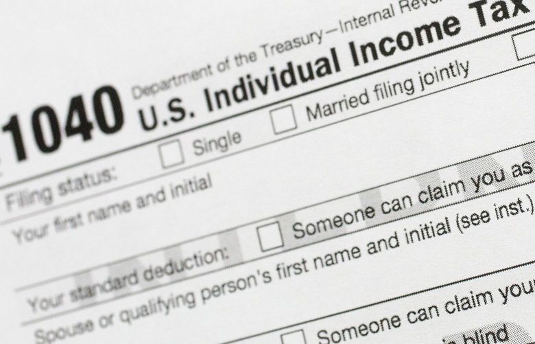 FILE – This July 24, 2018, file photo shows a portion of the 1040 U.S. Individual Income Tax Return form. The Trump administration is working on plans to delay the April 15 federal tax deadline for most individual taxpayers as well as small businesses. Treasury Secretary Steven Mnuchin told Congress on Wednesday, March 11, 2020, that the administration is “looking at providing relief to certain taxpayers and small businesses who will be able to get extensions on their taxes.” (AP Photo/Mark Lennihan, File)
