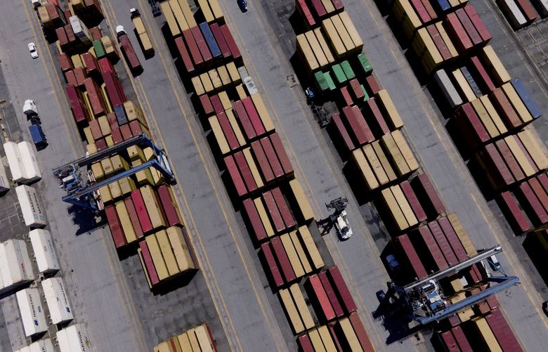 Shipping containers are stacked together at the Port of Baltimore, Friday, Aug. 12, 2022, in Baltimore. The Associated Press found more than 3,600 shipments of wood, metals, rubber and other goods have arrived at U.S. ports from Russia since it began launching missiles and airstrikes into its neighbor in February. (AP Photo/Julio Cortez) NY652 NY652