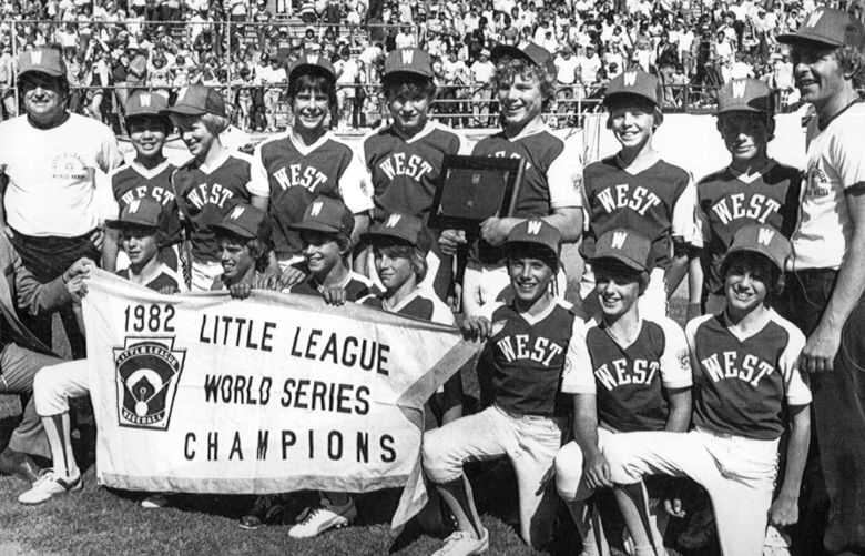 Members of Kirkland’s 1982 Little League World Series champs pose for a photo after they defeated Taiwan 6-0 in the championship game of the LIttle League World Series in Williamsport, PA. Holding the winnerâ€™s plaque in read is winning pitcher Cody Webster. At left is manager Don Cochran and at right is Coach Pat Downs. 
Kirkland Little League 1982