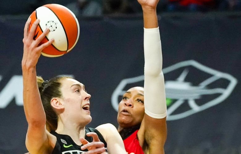 Seattle Storm’s Breanna Stewart, left, shoots as Las Vegas Aces’ A’ja Wilson defends in the second half of a WNBA basketball game Saturday, May 15, 2021, in Everett, Wash. The Storm won 97-83. (AP Photo/Elaine Thompson) WAET112