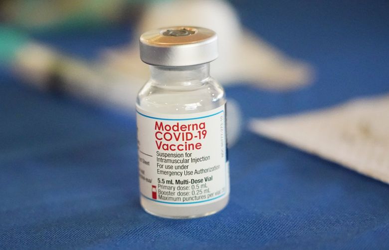 FILE – A vial of Moderna COVID-19 vaccine rests on a table at an inoculation station next to Jackson State University in Jackson, Miss., on July 19, 2022. British health authorities have authorized an updated version of Moderna’s coronavirus vaccine that aims to protect against the original virus and the omicron variant. (AP Photo/Rogelio V. Solis) ALP101 ALP101