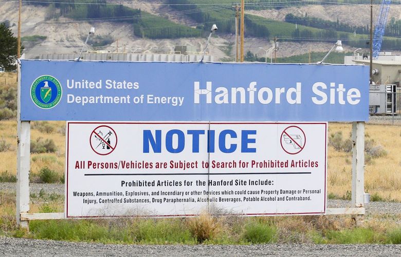 FILE – In this July 9, 2014 file photo, a sign informs visitors of prohibited items on the Hanford Site near Richland, Wash. The U.S. Department of Energy has confirmed that two underground structures at the decommissioned Hanford nuclear reservation in Washington state have been stabilized after they were deemed at risk of collapsing and spreading radioactive contamination into the air. (AP Photo/Ted S. Warren, File) FX204
