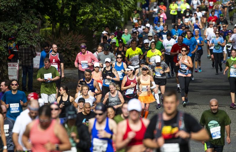 Runners in the annual St. Jude Rock ‘n’ Roll Marathon come down Highland Drive near Kerry Park in the Queen Anne neighborhood of Seattle Sunday, June 9 2019. 210497
