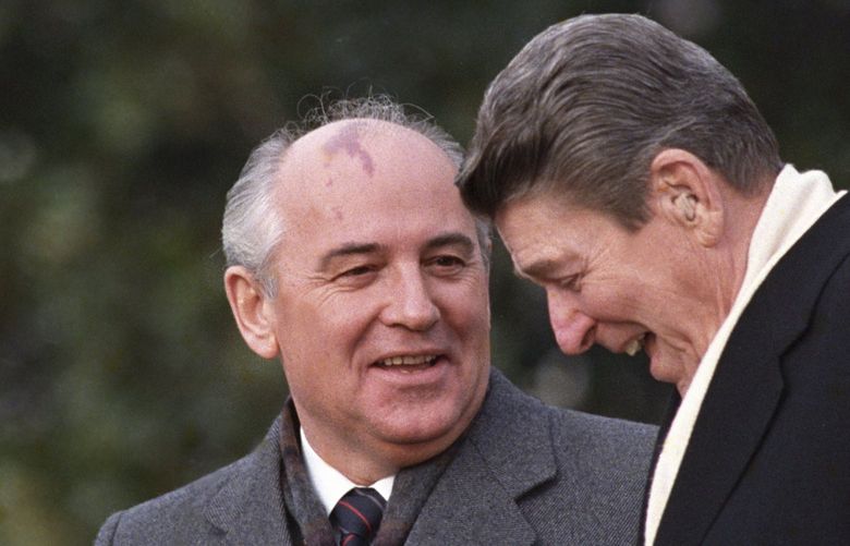 FILE – U.S. President Ronald Reagan, right, talks with Soviet leader Mikhail Gorbachev during arrival ceremonies at the White House where the superpowers begin their three-day summit talks in Washington, D.C., Tuesday, Dec. 8, 1987. Russian news agencies are reporting that former Soviet President Mikhail Gorbachev has died at 91. The Tass, RIA Novosti and Interfax news agencies cited the Central Clinical Hospital. (AP Photo/Boris Yurchenko, File) RGO134 RGO134