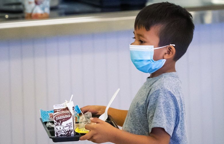 Julio Mendoza Cruz, 6, returns his tray at lunchtime at Hazel Valley Elementary School in Burien, which has extra protocol in place for stopping the spread of illnesses like the coronavirus.



Thursday October 7, 2021.