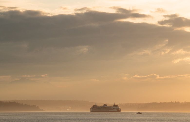 A ferry passes by storm clouds on Puget Sound Thursday, June 2, 2022. 

LO 220606
