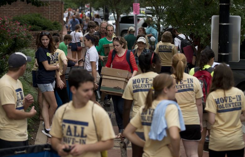 Students move into a dorm at George Washington University in D.C. in 2012. MUST CREDIT: Washington Post photo by Marvin Joseph