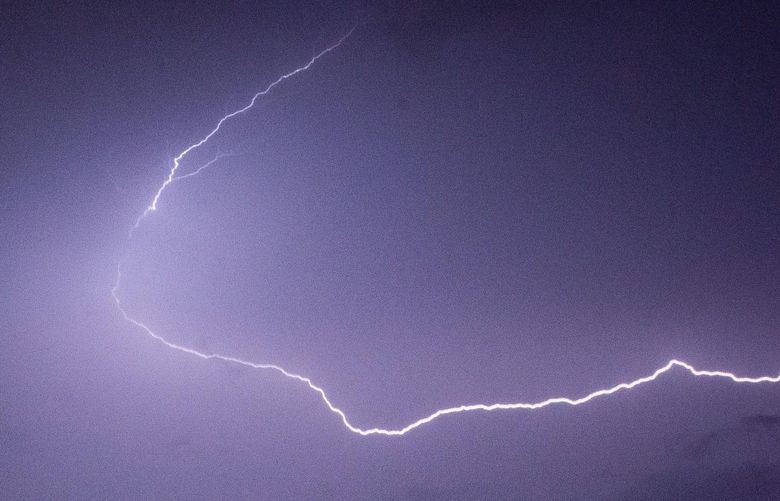 Lightning strikes as the game is delayed due to severe weather in the first quarter. The Washington Huskies played the California Golden Bears in a NCAA football game at Husky Stadium in Seattle, Wash., on Saturday, Sept. 7, 2019.