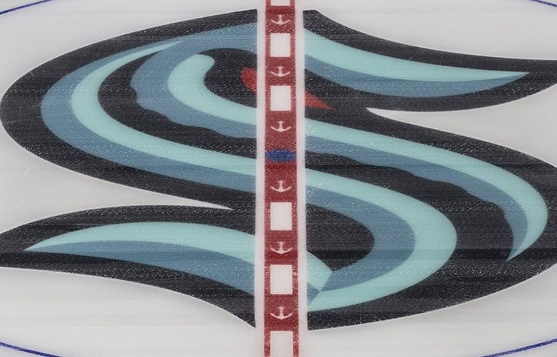 The Kraken logo is located at center ice at Climate Pledge Arena at Seattle Center on Saturday, Oct. 16, 2021.  218527