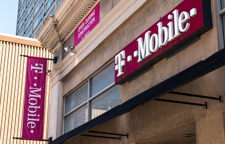 Signage for a T-Mobile store in San Francisco, California, U.S., on Tuesday, March 16, 2021. T-Mobile US Inc. is kicking off a bond sale to help finance the purchase of new high-speed spectrum licenses as carriers roll out the next generation of mobile devices. Photographer: David Paul Morris/Bloomberg