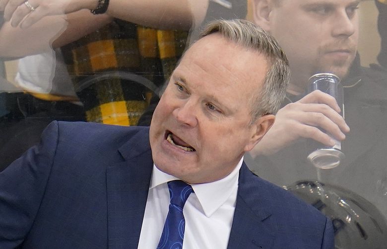 Winnipeg Jets interim head coach Dave Lowry gives instructions during the third period of an NHL hockey game against the Pittsburgh Penguins in Pittsburgh, Sunday, Jan. 23, 2022. The Penguins won in a shootout 3-2. (AP Photo/Gene J. Puskar)