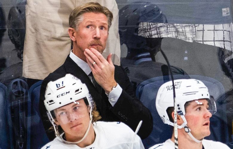Kraken head coach Dave Hakstol looks at the scoreboard when Nashville ties the game in the 2nd period.
.
The Seattle Kraken played the Nashville Predators at Bridgestone Arena in Nashville, TN, Thursday, October 21, 2021. 218517 218517