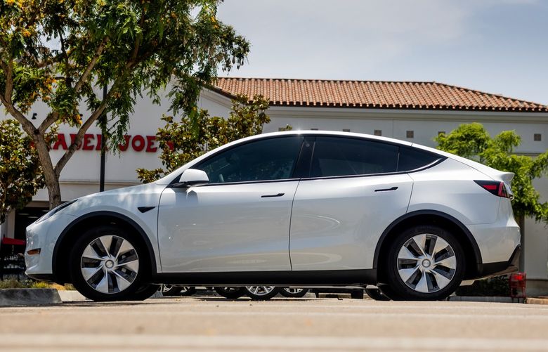FILE – A Tesla Model Y in San Diego on July 22, 2021. Tesla’s website says buyers of a Model Y, with a purchase price of $66,000, can’t expect delivery until next year. (Roger Kisby/The New York Times)