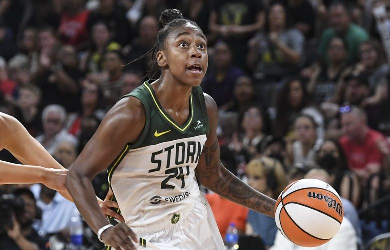 Seattle Storm guard Jewell Loyd (24) drives past Las Vegas Aces guard Kelsey Plum (10) during the second half of a WNBA game Sunday, Aug. 14, 2022, in Las Vegas. (AP Photo/Sam Morris) NVSM112 NVSM112