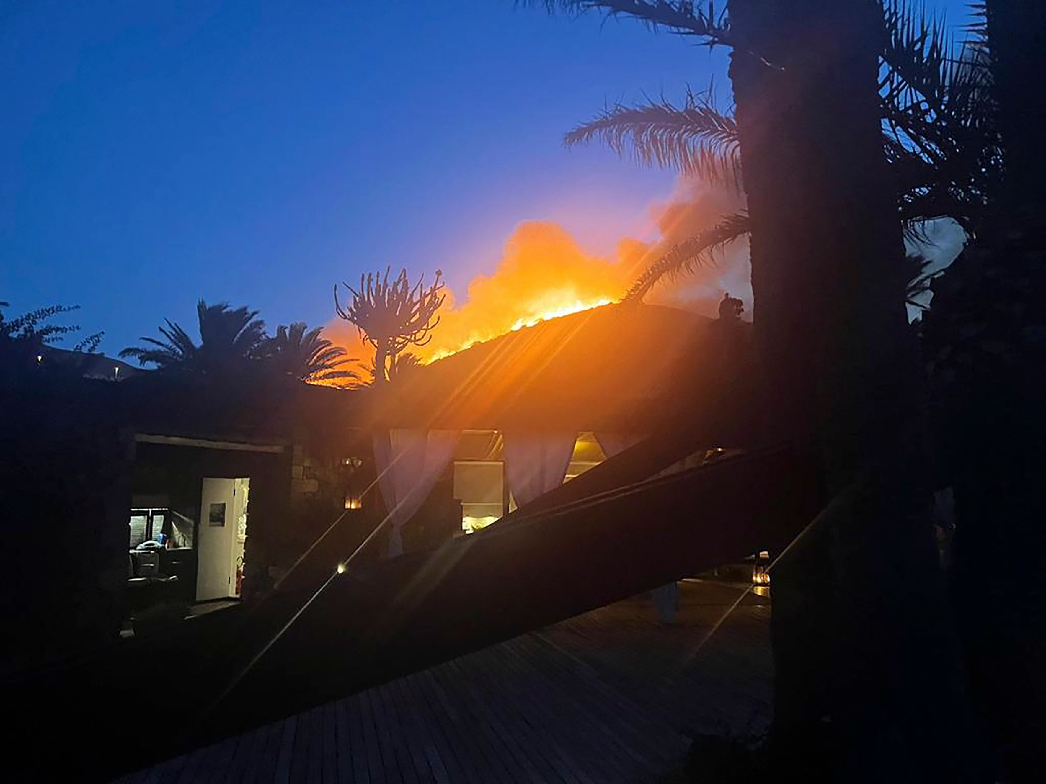 Designer Armani and guests flee wildfire on Sicilian island | The