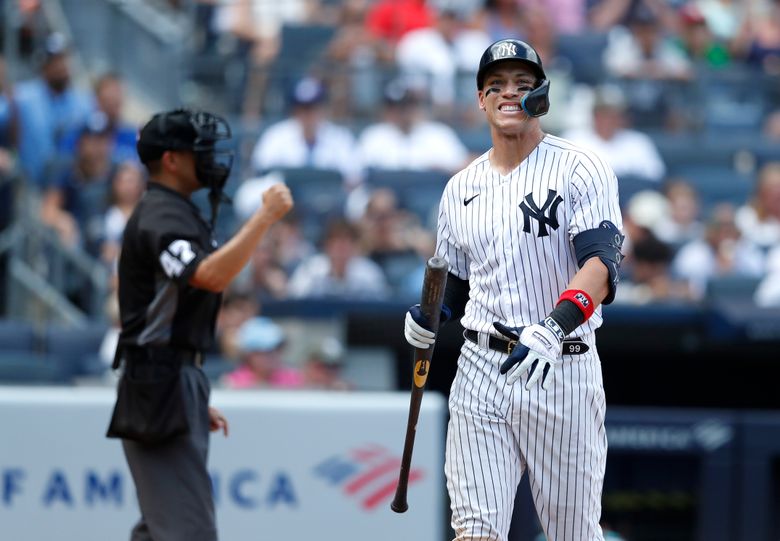 Retired New York Yankees player Paul O'Neill walks down the line