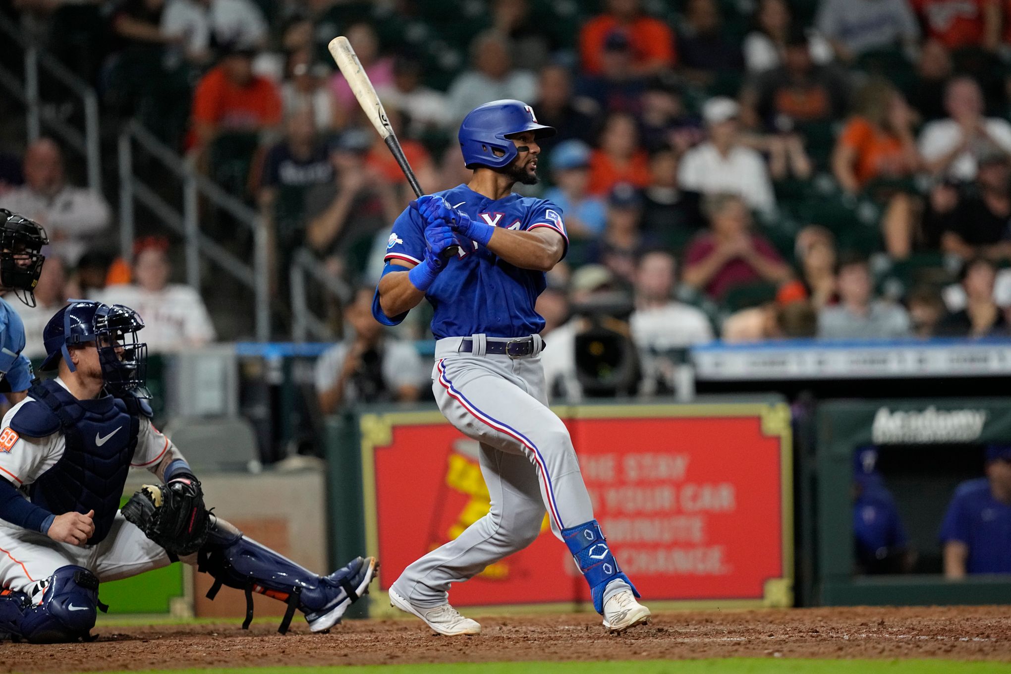 Texas Rangers' Leody Taveras hits an RBI-single against the