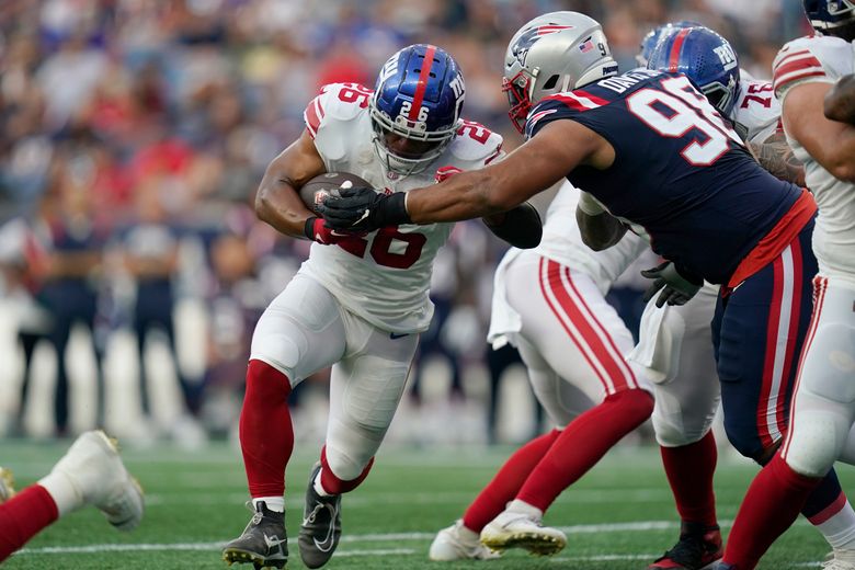 Saquon Barkley of the New York Giants runs with the ball against