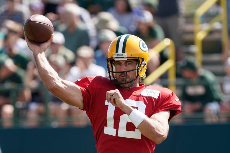 Green Bay Packers' Christian Watson runs a drill during NFL