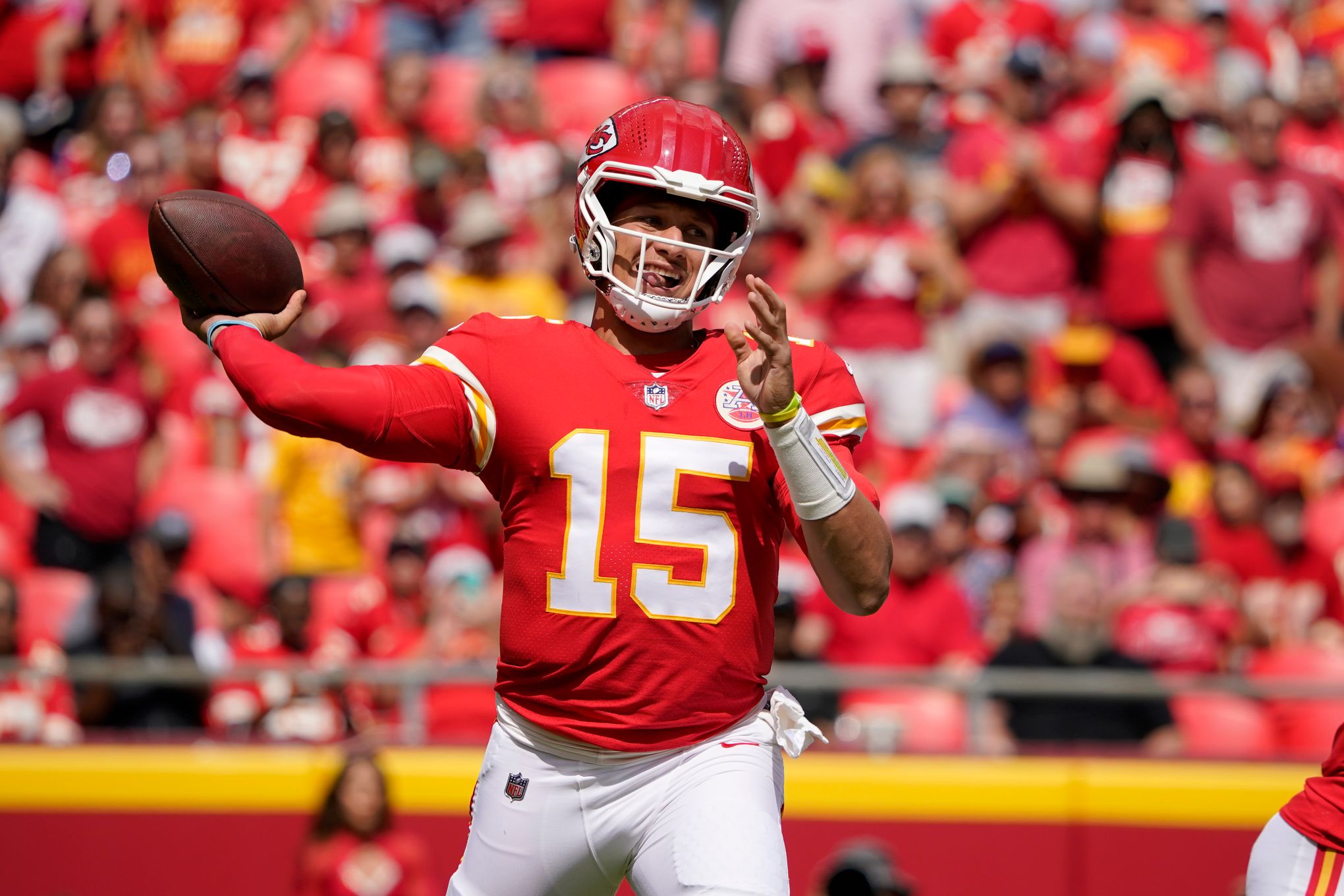 Washington Commanders quarterback Carson Wentz (11) talks with Kansas City  Chiefs quarterback Patrick Mahomes (15) prior