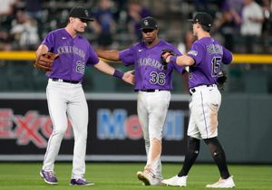 C.J. Cron homers, triples, Rockies beat Rangers in extras