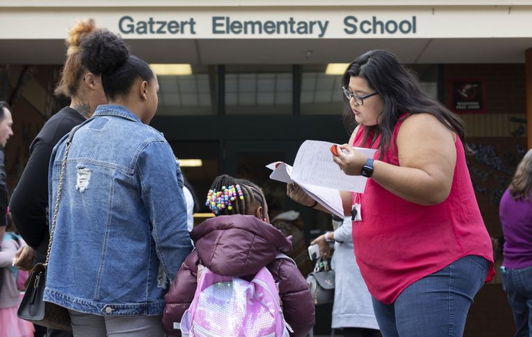 Parents, a student, and a volunteer at Bailey Gatzert Elementary
