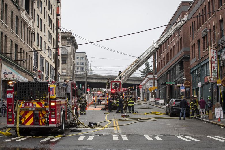 Seattle Fire responds to the scene at Harbor City, a restaurant in the Chinatown International District, after a fire broke out on Thursday. (Kylie Cooper / The Seattle Times)