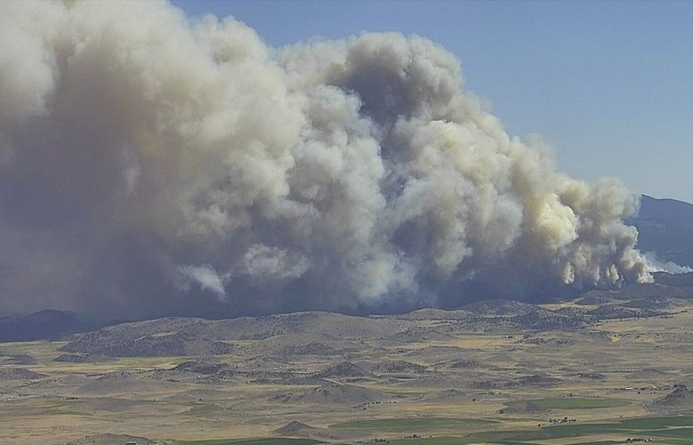 In this image from a Cal Fire monitoring camera on Antelope Mountain, the Mill Fire burns near Weed, Calif., Friday Sept. 2, 2022. (Cal Fire/ALERTWildfire Network via AP) FX509 FX509