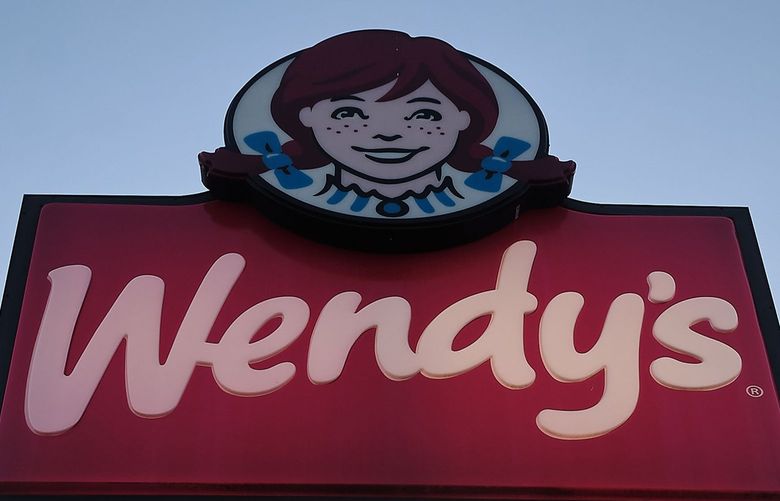 A sign at the Wendy’s fast food restaurant is shown in Uvalde, Texas. Cases of food-borne illness linked to Wendyâ€™s restaurants have spread, now sickening people across six states, according to the Centers for Disease Control and Prevention. (Carlos Escalona/Zuma Press/TNS)