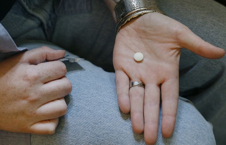An abortion pill is held before being taken in Putney, Vt. on July 29, 2022. Medication abortion was legalized in the United States in 2000 and typically involves two drugs: mifepristone, which blocks a necessary hormone, followed by misoprostol, which causes contractions that expel pregnancy tissue. (Kelly Burgess/The New York Times) XNYT12 XNYT12