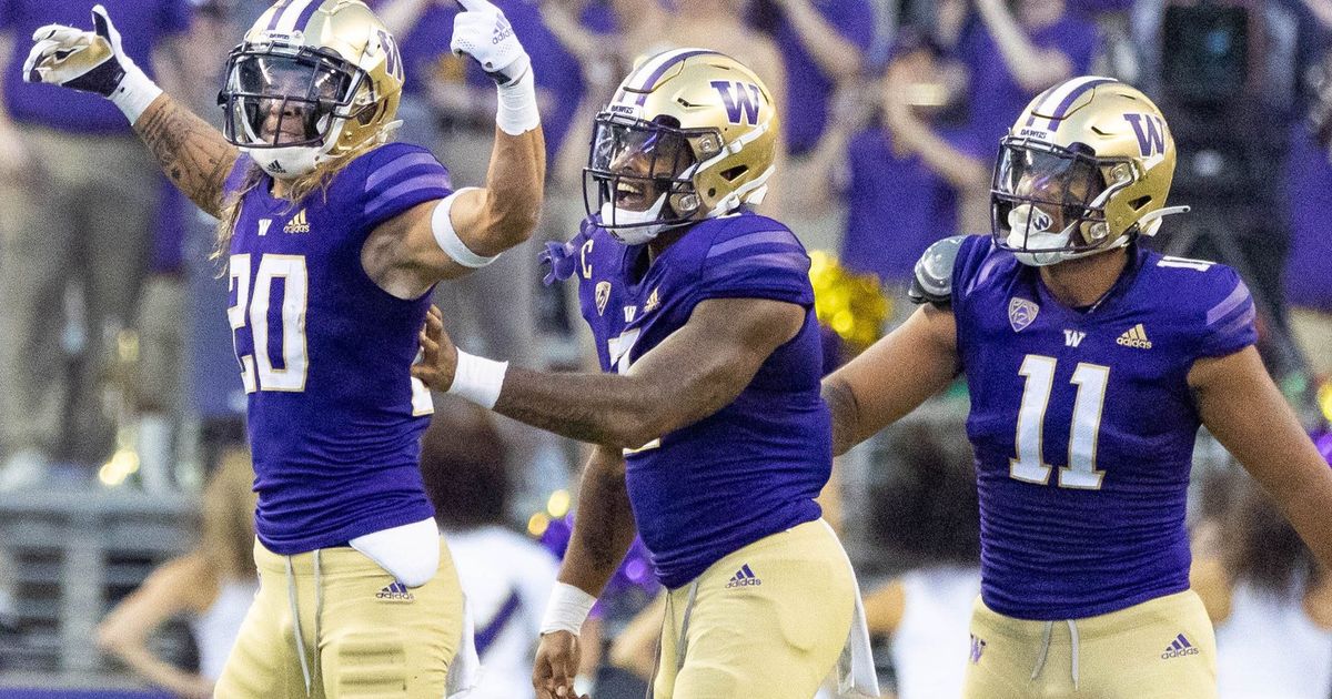 Washington Huskies finally get a win with 52-3 romp over Arkansas