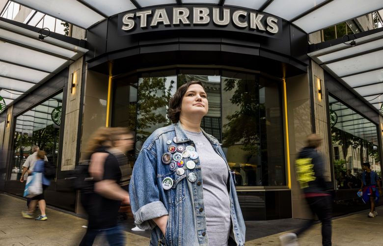 Starbucks employee and worker organizer Sarah Pappin is photographed outside the storefront at the intersection at Pike Street and 5th Avenue in Seattle on Saturday, Sept. 3, 2022.