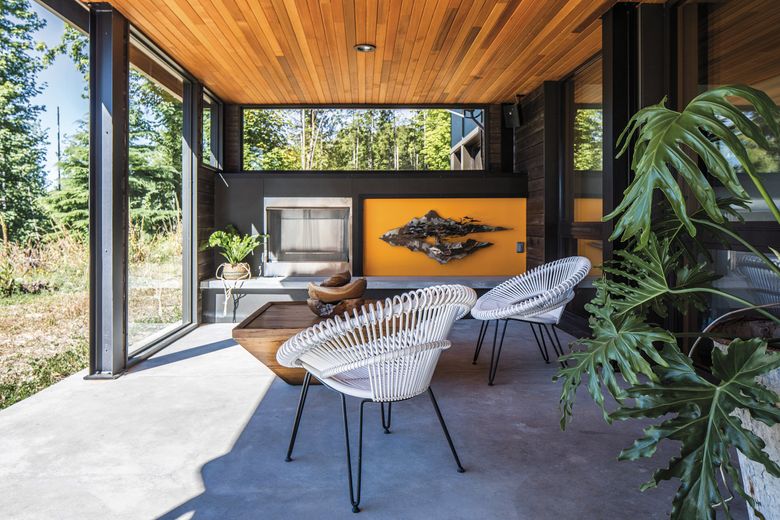 Architect Tessa Bradley, a partner at Artisans Group, says she prefers siting fireplaces outdoors, especially for super-efficient Passive Houses, like Delphi Haus near Olympia. “The ambience is real; staring at fire is real. That’s why I like putting them outside,&#8221; she says. &#8220;The things that make us feel warmth aren’t just fireplaces; there are a lot of ways to feel uncomfortable in a typical building, and when you build a Passive House, you eliminate those discomforts.” (Poppi Photography)