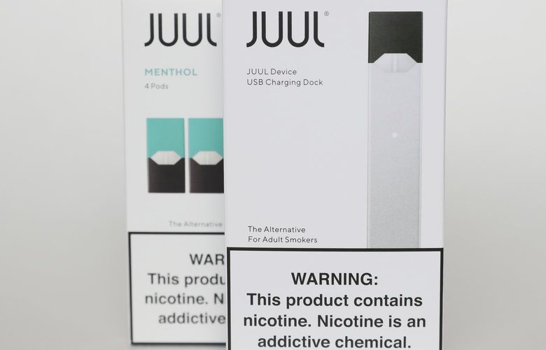 FILE – Packaging for an electronic cigarette and menthol pods from Juul Labs is displayed on Feb. 25, 2020, in Pembroke Pines, Fla. In a deal announced Tuesday, Sept. 6, 2022, electronic cigarette maker Juul Labs will pay nearly $440 million to settle a two-year investigation by 33 states into the marketing of its high-nicotine vaping products, which have long been blamed for sparking a national surge in teen vaping. (AP Photo/Brynn Anderson, File) NYAB206 NYAB206