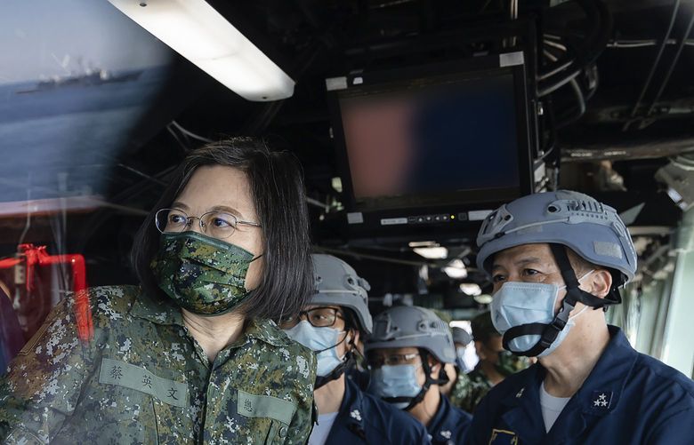 FILE – In this photo released by the Taiwan Presidential Office, Taiwan’s President Tsai Ing-wen is seen through glass onboard a navy ship during inspection of Taiwan’s annual Han Kuang exercises in Taiwan on Tuesday, July 26, 2022. Tsai said Tuesday, Sept. 6, 2022, that China is conducting â€œcognitive warfareâ€ by spreading misinformation in addition to its regular incursions into nearby waters and airspace intended at intimidating the self-governing island. (Shioro Lee/Taiwan Presidential Office via AP, File) BKWS301 BKWS301