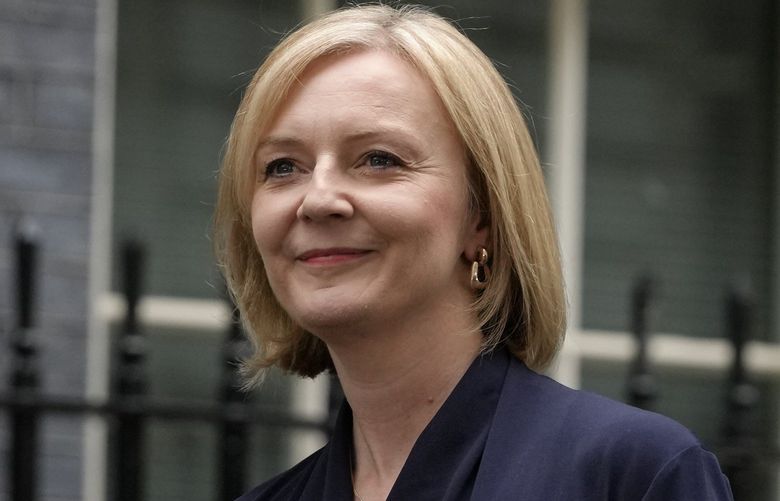 New British Prime Minister Liz Truss arrives to make an address outside Downing Street in London Tuesday, Sept. 6, 2022 after returning from Balmoral in Scotland where she was formally appointed by Britain’s Queen Elizabeth II. (AP Photo/Kirsty Wigglesworth) FP116 FP116