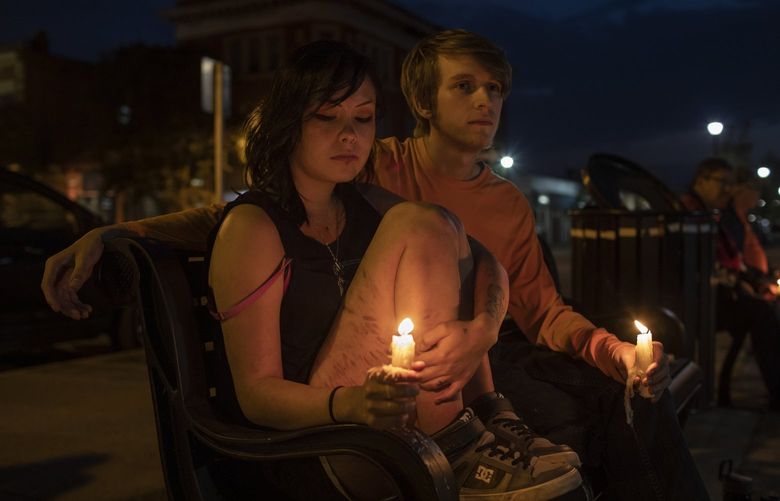 Jasmine Begon and Wylie Oliver hold candles during. A vigil organized by the First Nations University of Canada for victims of the mass stabbing, in Prince Albert, Saskatchewan, Canada on Wednesday, Sept. 7, 2022. Oliver, who did not know any of the victims, felt it was important to show that the entire community supports them. (Amber Bracken/The New York Times) XNYT16 XNYT16