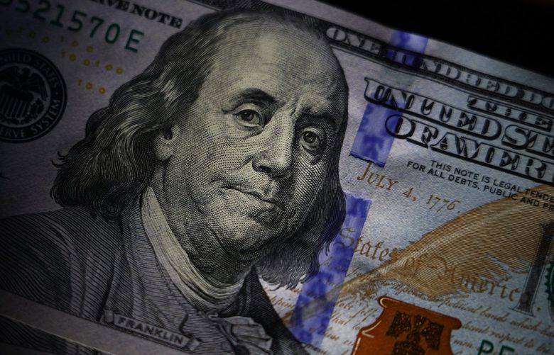 The likeness of Benjamin Franklin is seen on U.S. $100 bills on July 14, 2022. Money rules of thumb can be useful guardrails, helping you allocate spending and determine what is  affordable. They can also be incredibly defeating when they feel unattainable. (Matt Slocum / The Associated Press)