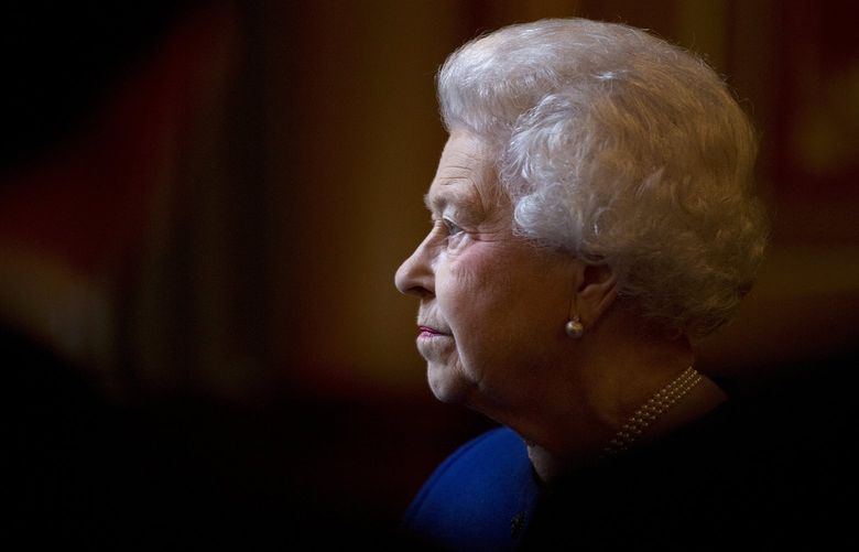 FILE – In this Dec. 18, 2012 file photo Britain’s Queen Elizabeth II escorted by British Foreign Secretary William Hague, unseen, tours The Foreign and Commonwealth Office during an official visit which is part of her Jubilee celebrations in London. Queen Elizabeth II, Britain’s longest-reigning monarch and a rock of stability across much of a turbulent century, has died. She was 96. Buckingham Palace made the announcement in a statement on Thursday Sept. 8, 2022. (AP Photo/Alastair Grant, Pool, File) QER158 QER158