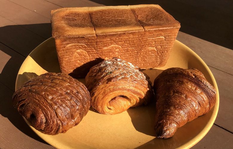 Savvy Seattle shoppers are obsessed with the Too Good To Go app, which sells food surplus and foods near their “best by” date for pennies on the dollar. A sample purchase from Temple Pastries in the Central District: a $5.99 order of three rye pastries and a loaf of milk bread.