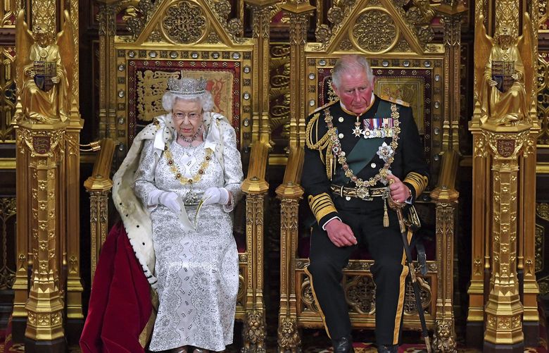 FILE – In this Oct. 14, 2019 file photo, Britain’s Queen Elizabeth II, with Prince Charles, delivers the Queen’s Speech at the official State Opening of Parliament in London. Prince Charles has been preparing for the crown his entire life. Now, that moment has finally arrived. Charles, the oldest person to ever assume the British throne, became king on Thursday Sept. 8, 2022, following the death of his mother, Queen Elizabeth II. (Victoria Jones/Pool via AP, File) HRHC145 HRHC145