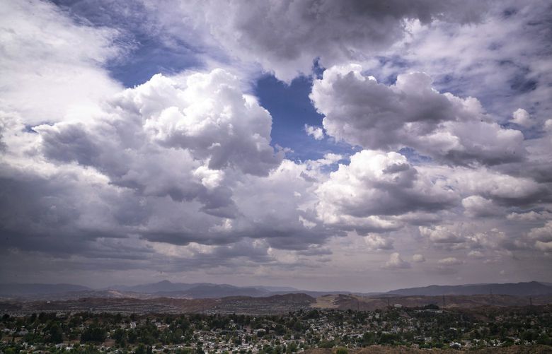 Clouds developing from Tropical Storm Kay move over the Santa Clarita valley, Friday, Sept. 9, 2022, in California. A flood watch is in effect for some areas of Southern California through Saturday evening as the storm moves through the area. (David Crane/The Orange County Register via AP) CAANR561 CAANR561