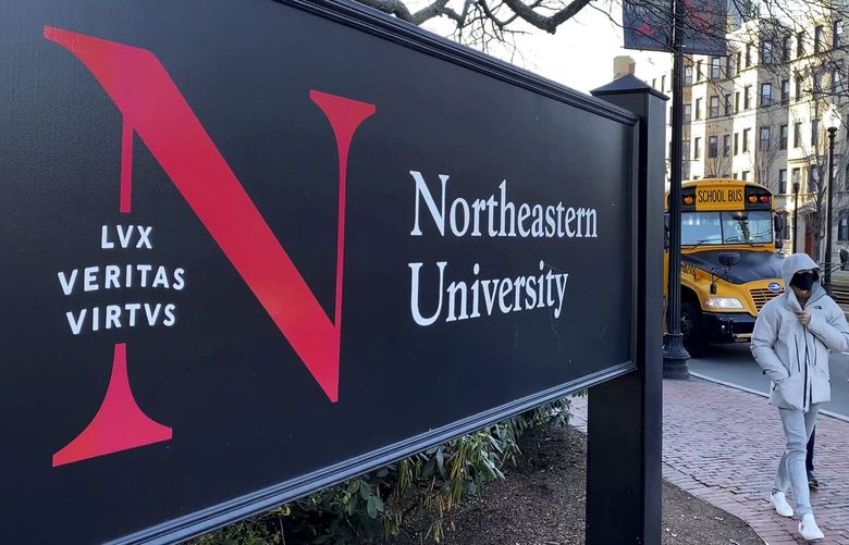 FILE – Students walk on the Northeastern University campus in Boston on Jan. 31, 2019. A police bomb squad sealed off part of the campus of Northeastern University late Tuesday, Sept. 13, 2022, to examine a pair of suspicious packages, and there were unconfirmed reports of an explosion and minor injuries to at least one person. (AP Photo/Rodrique Ngowi, File) NYCD401 NYCD401