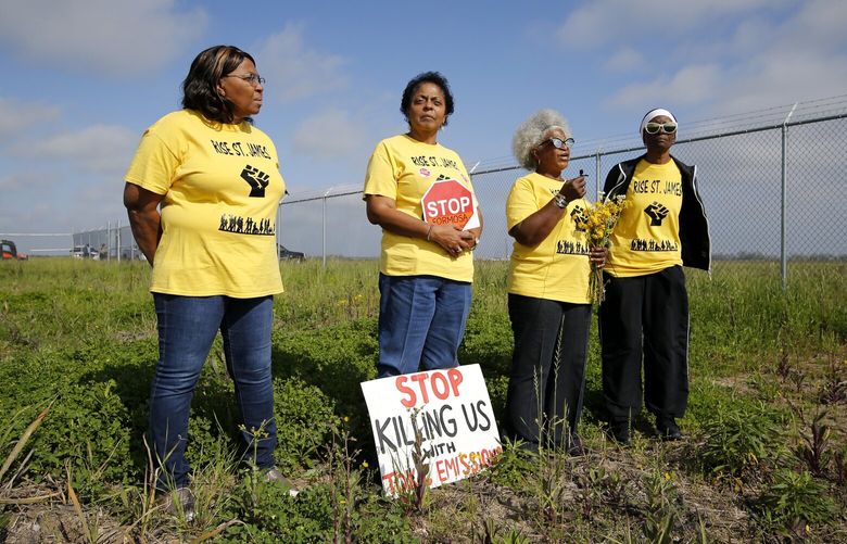 FILE – Myrtle Felton, from left, Sharon Lavigne, Gail LeBoeuf and Rita Cooper, members of RISE St. James, conduct a live stream video on property owned by Formosa on March 11, 2020, in St. James Parish, La. A Louisiana judge has thrown out air quality permits for a Taiwanese companyâ€™s planned $9.4 billion plastics complex between New Orleans and Baton Rouge, Wednesday, Sept. 14, 2022, a rare win for environmentalists in a heavily industrialized stretch of the Mississippi River often referred to as â€œCancer Alley.” (AP Photo/Gerald Herbert, File) NYAB405 NYAB405