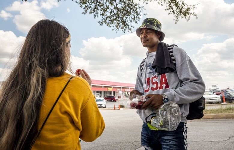 Luis Amador Castillo, right, from Venezuela, outside the Migrant Resource Center in San Antonio, Texas on Thursday, Sept. 15, 2022. The political drama surrounding immigration escalated this week when Gov. Greg Abbott (R-Texas) sent two busloads of migrants to Vice President Kamala Harris’s residence in Washington and Gov. Ron DeSantis (R-Fla.) sent two planeloads of migrants to Martha’s Vineyard. (Matthew Busch/The New York Times) XNYT259 XNYT259