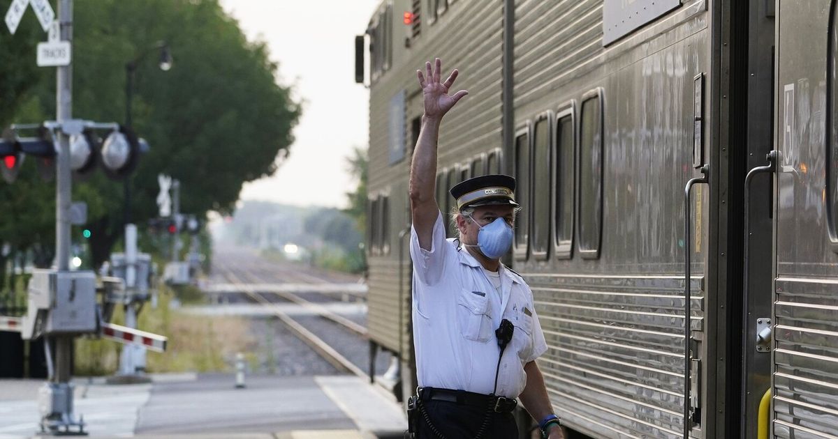 Rail workers win key concessions in deal to prevent strike