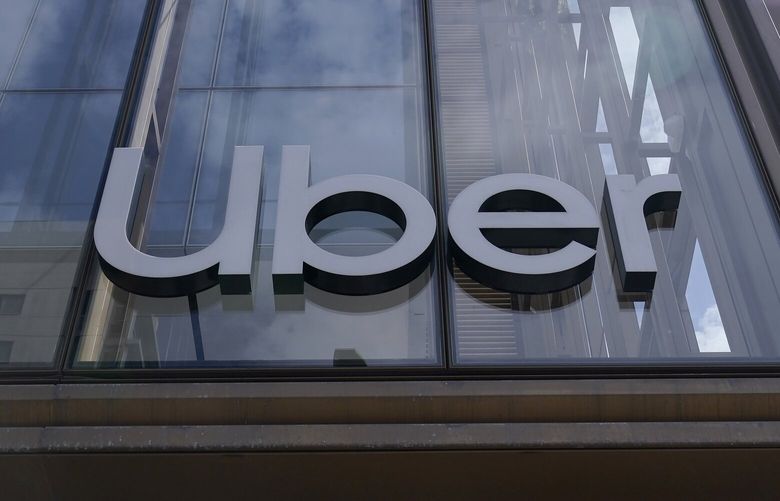 FILE – An Uber sign is displayed at the company’s headquarters in San Francisco, Monday, Sept. 12, 2022. (AP Photo/Jeff Chiu, File) 