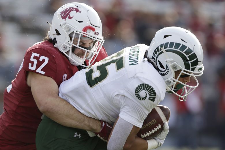 Washington State linebacker Kyle Thornton, left, tackles Colorado State running back Avery Morrow during the second half of an NCAA college football game, Saturday, in Pullman. Washington State won 38-7. (Young Kwak / The Associated Press)