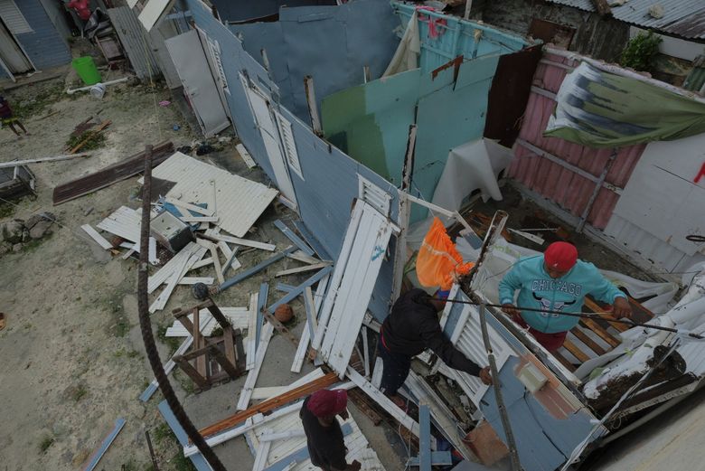 Residents replace a home’s roof that was torn off by Hurricane Fiona in the low-income neighborhood of Kosovo in Veron de Punta Cana, Dominican Republic, Monday, Sept. 19, 2022. (AP Photo/Ricardo Hernandez) XRE102 XRE102 (Ricardo Hernandez / The Associated Press)