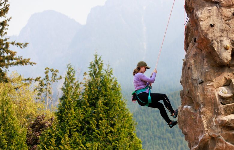 Chlo‘ Thompson climbs with Bradley Dosch (not pictured) at Torguson Park in North Bend, Wash. 
 221492